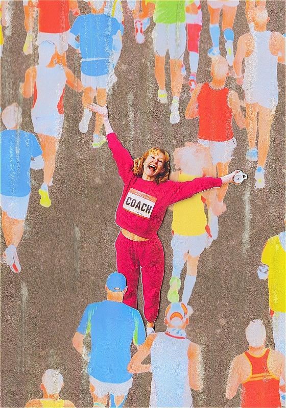 A woman wearing a pink tracksuit celebrates as people run past her.