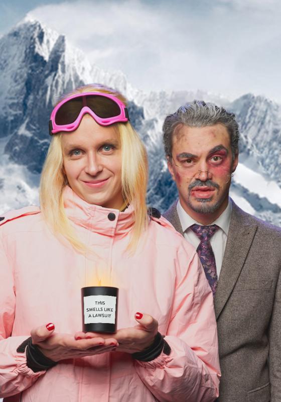 Linus as Gwyneth wears a pink ski suit with long blonde hair and pink ski googles. She holds a GOOP branded candle with the label 'smells like a lawsuit' in front. Directly behind her stands Joseph as Terry who appears bruised, dishevelled and wearing a grey suit and tie for the courtroom. The back drop is a snowy mountain scene.