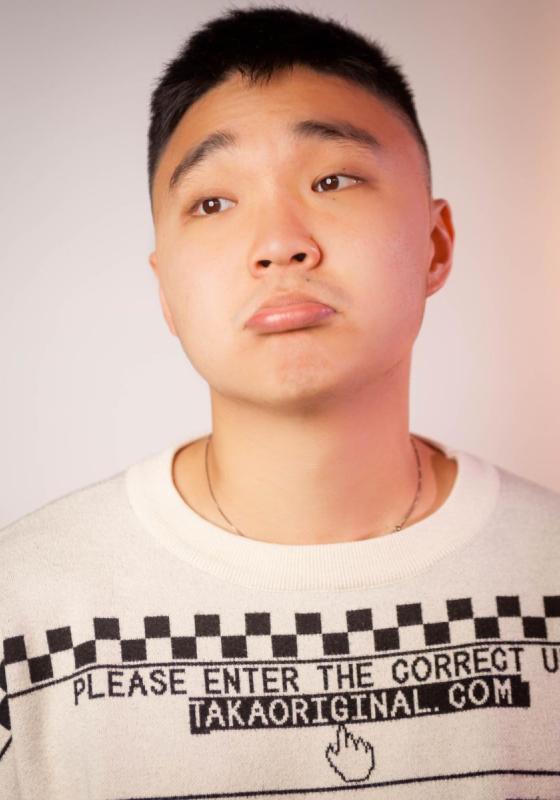 JinHao LI pouting in a white graphic top