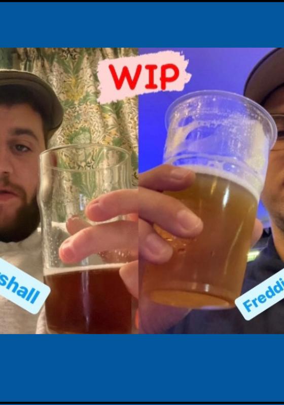 Picture collage of the two performers with a pint in their hand. They're both wearing caps. Their names are printed below them and WIP (work-in-progress) is at the top in red comic sans.