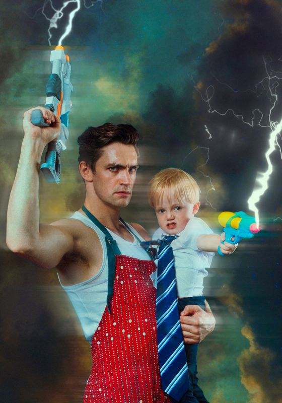 A man holds a baby. They're both in front of a thunderous background holding water pistols shooting out electric energy.
