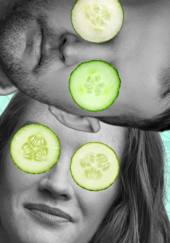 The faces of two people are obscured by cucumbers on their eyes.