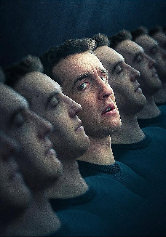 Artistic rendering of multiple identical male faces in a row with a gradual focus toward one central face looking perplexed or concerned among others in a passive state, all wearing dark sweaters against a dimly lit background.