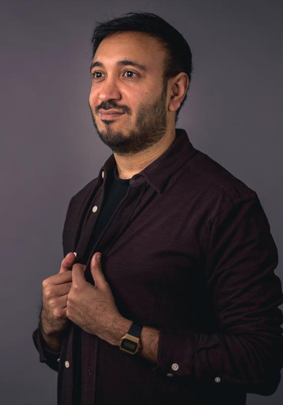 A person in a burgundy shirt