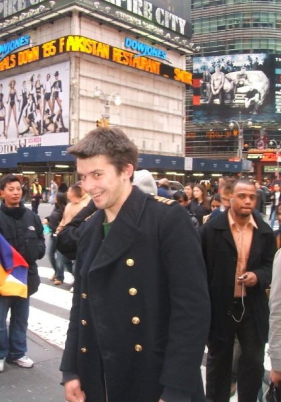 A throwback photo of Kieran Hodgson standing in New York Time Square
