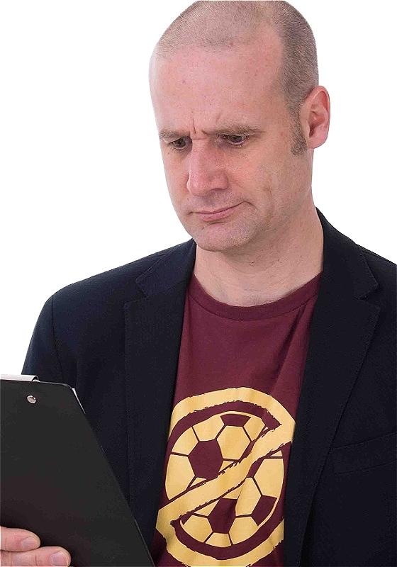 Matt holding a clipboard looking at it perplexed.