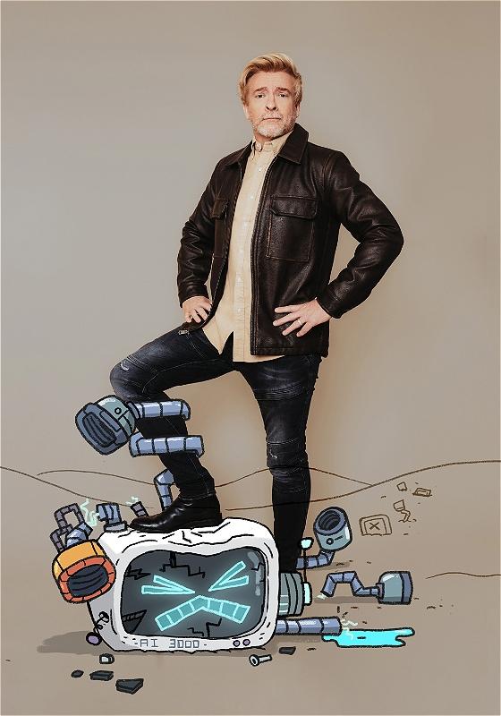 Man in leather jacket with hands on his hip, stands with one leg on a broke cartoon TV, with a sad face. A look of bemusement is on his face. 
