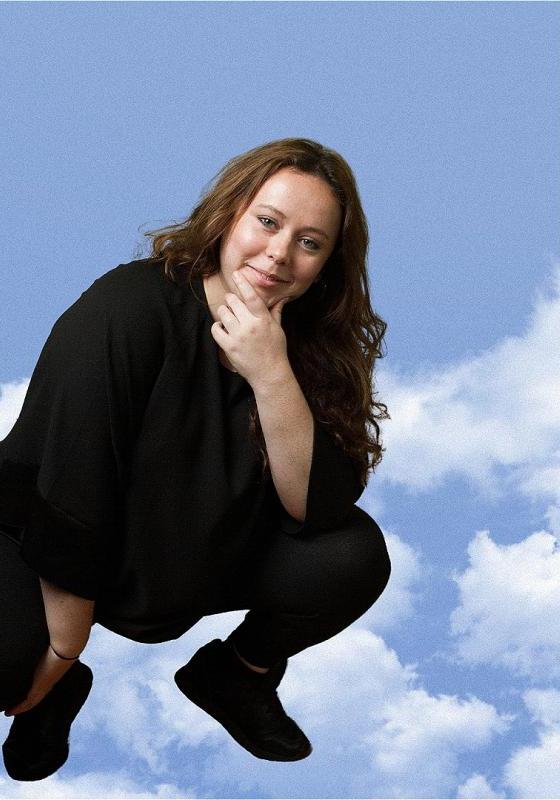 Amy Anette squatting in the clouds. 