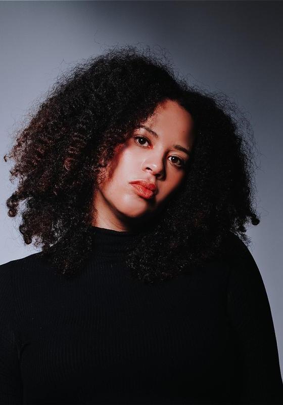 Mary headshot in black turtleneck