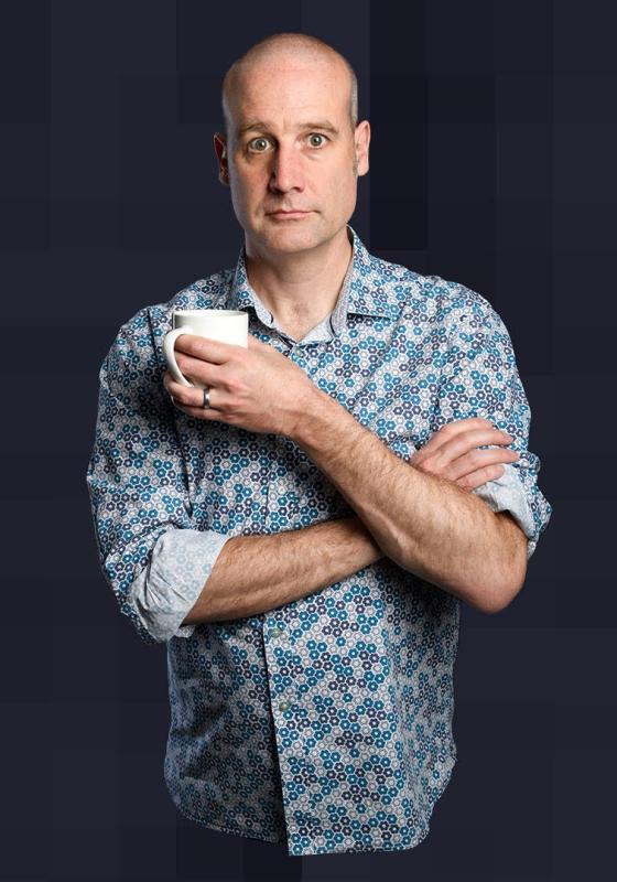 Matt looks into the camera perplexed while holding a white mug 