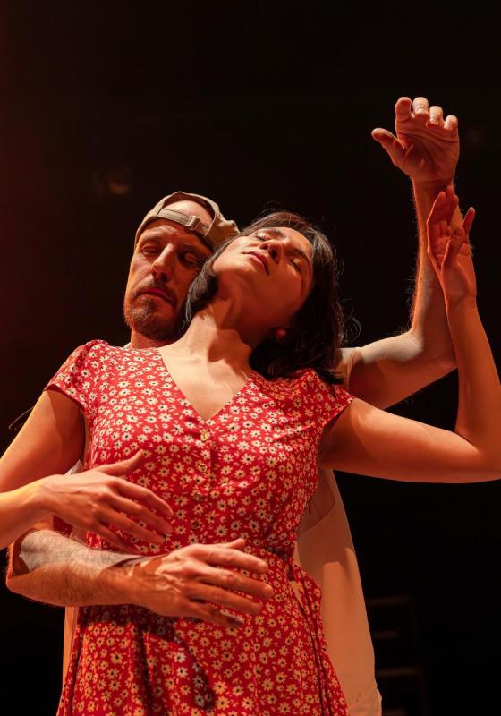 The two performers mid dance with their eyes closed