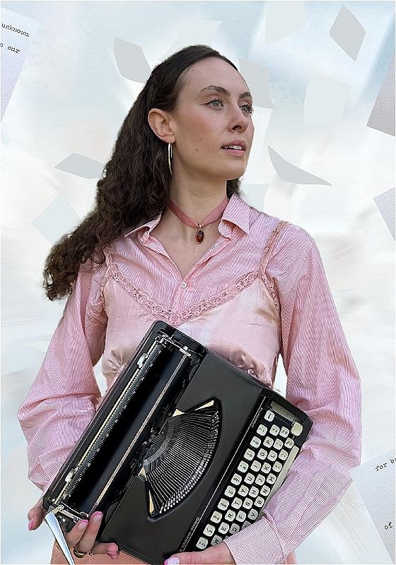 Woman wearing a pink holds a typewriter and is surrounded by falling pieces of paper and writing fragments.