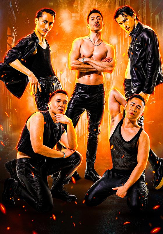 The Dragon Boiz posing against a fiery background.