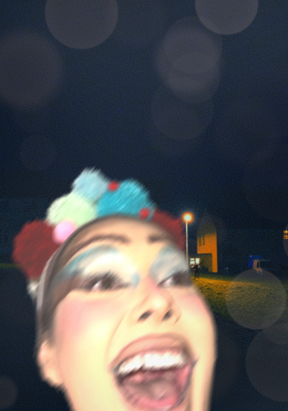 A blurry selfie of Patti Harrison with her mouth wide open 
