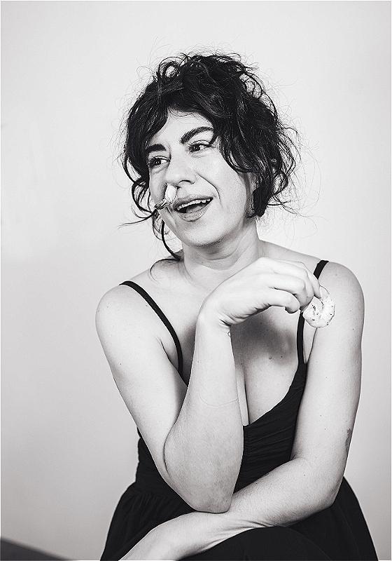 Black and white headshot of the performer.
