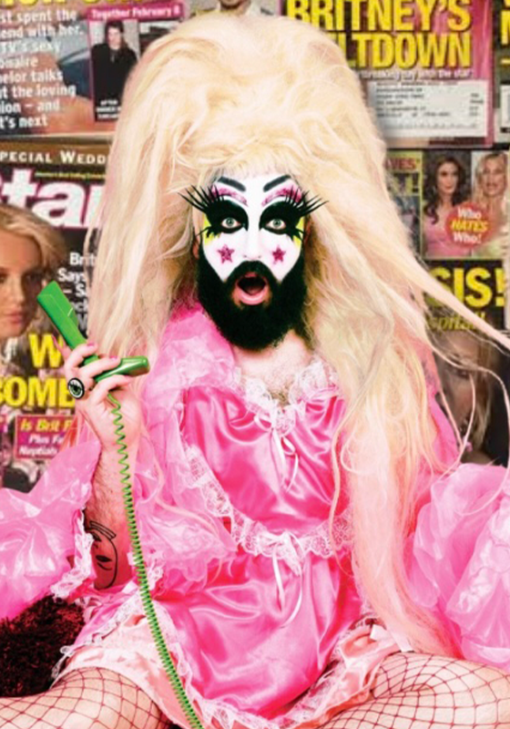 A fabulous looking Baby Lame wearing a pink dress and fishnets holds a green phone against a background of magazines featuring Britney headlines.