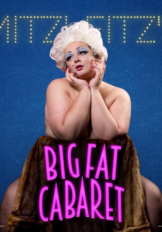 Nude performer sitting on a backwards chair cupping their face with their hands.