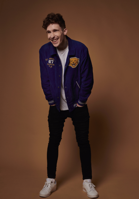 Photo of performer Larry Dean, smiling.