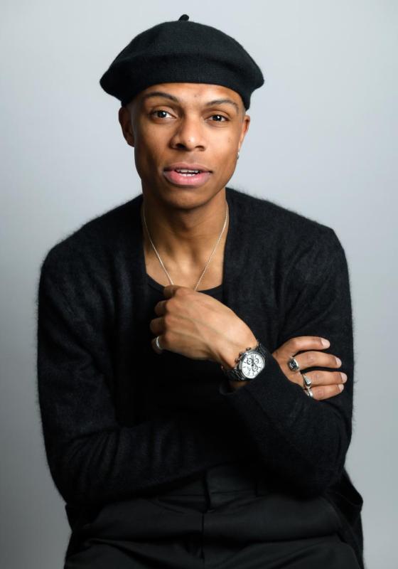 Fab dressed in all black wearing a beret.