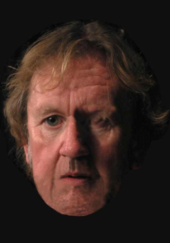 Pip Utton's face against a black background. Looking concerned. 
