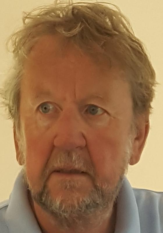 Pip Utton against a beige background looking concerned