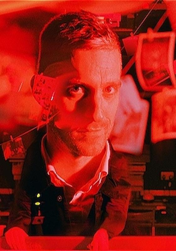Red and black coloured image of man with photographs hanging on a clothesline