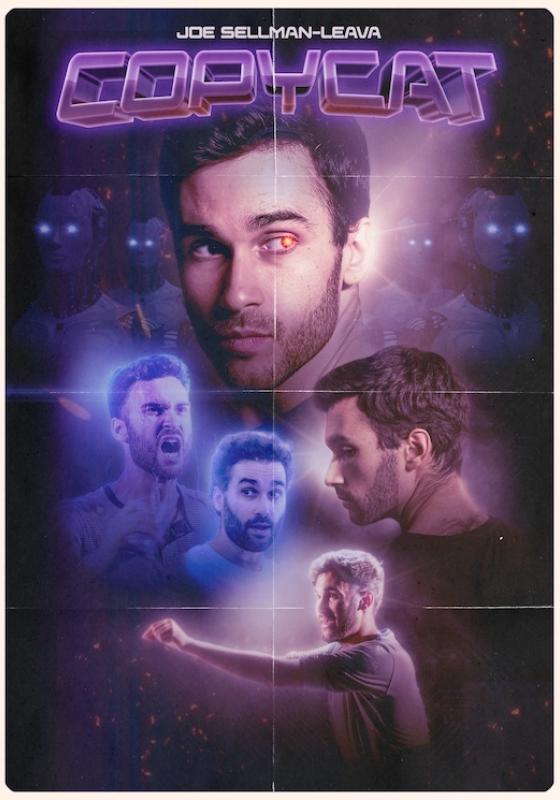 A man with dark hair and a beard looks back over his shoulder with one eye glowing red. In the background there are robotos with glowing white eyes