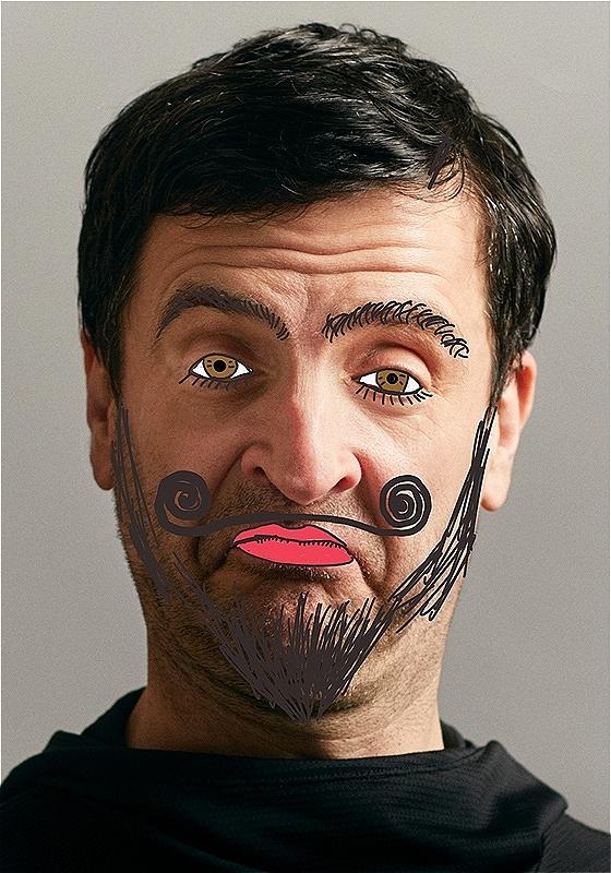 A man looks at you, with cartoon squiggles on his eye, a moustache, lips and a beard. 