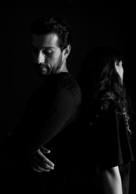 Black and white photo of a man and woman silhouetted