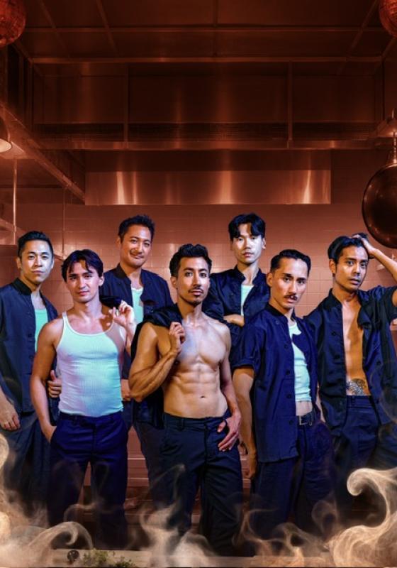 The Dragon Boiz posing in blue shirts with smoke around them