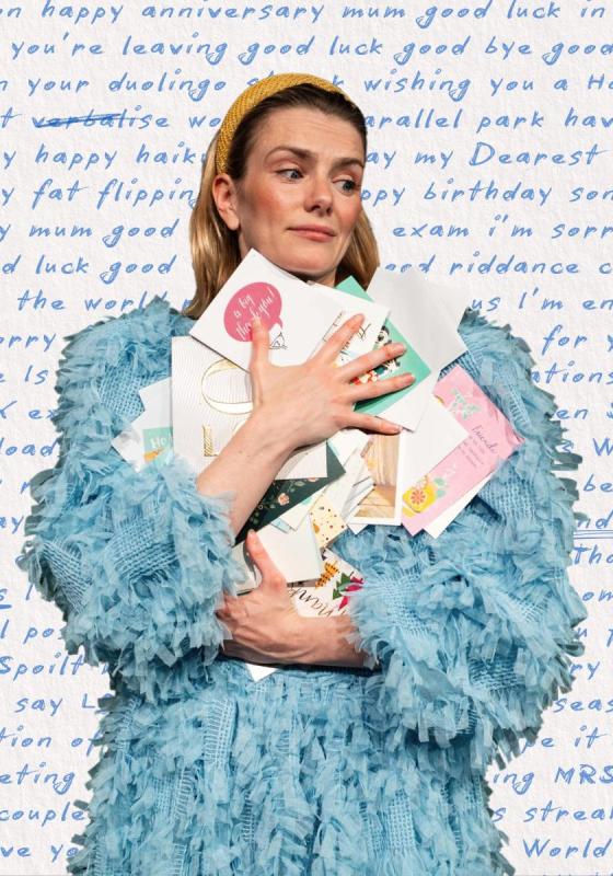 The performer clutches a pile of letters to their chest. Behind them is a large hand written letter with words circled and underlined.