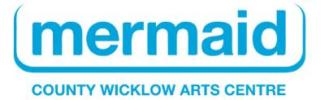 The word "mermaid" lower case, large and in bright blue with a frame around it and the words "County Wicklow Arts Centre" smaller and all uppercase underneath it 