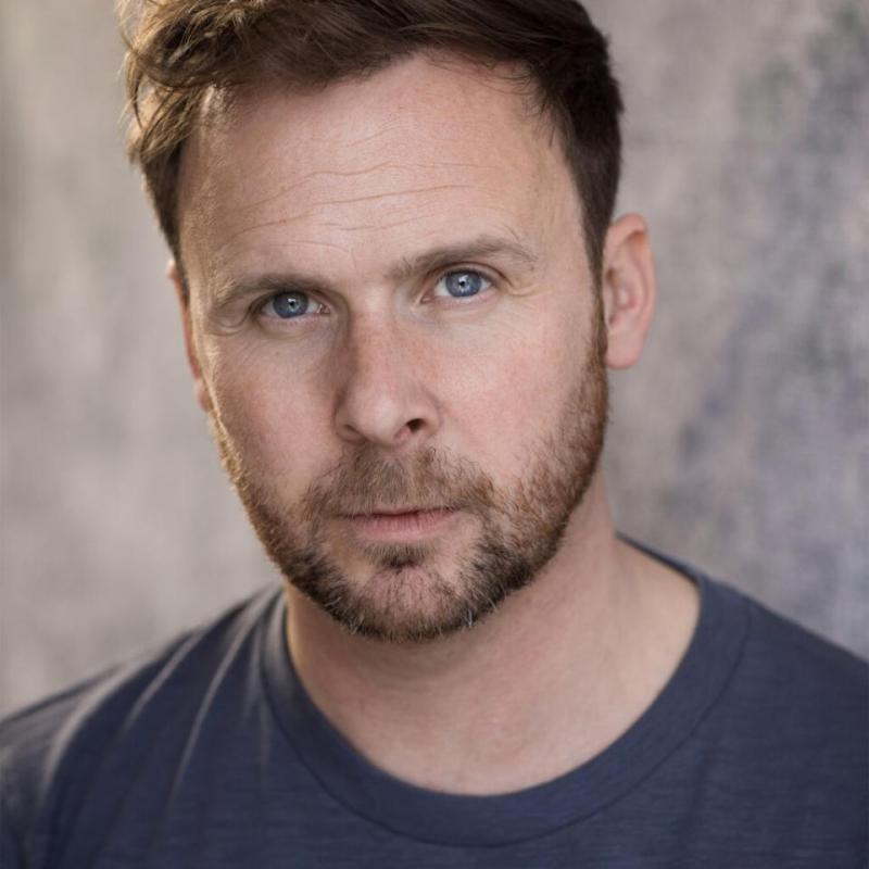 Headshot of Colin Hoult against a plain background