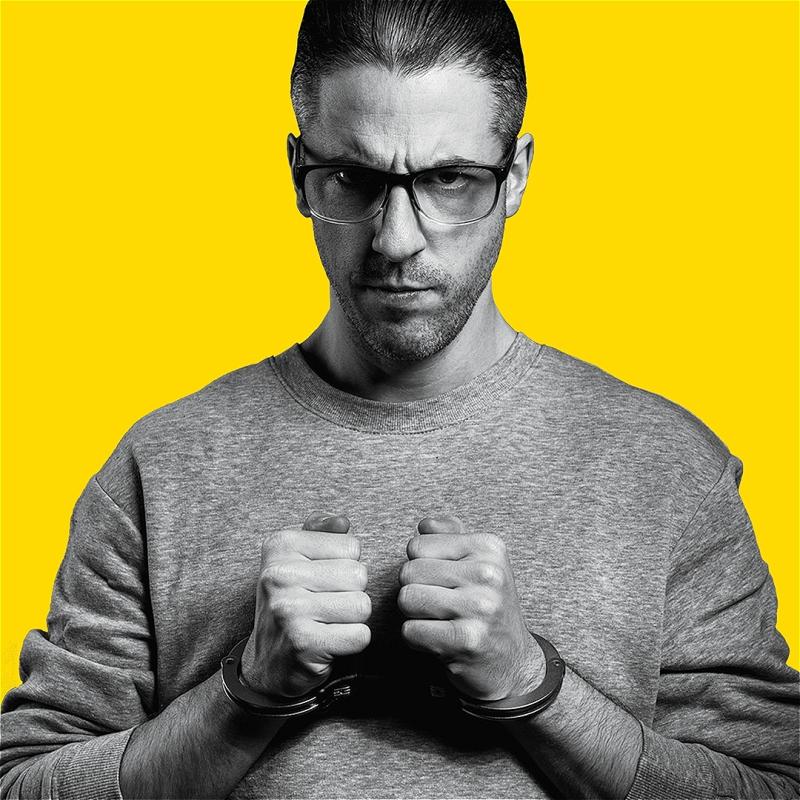 Grayscale picture of David in handcuffs, on a yellow background.