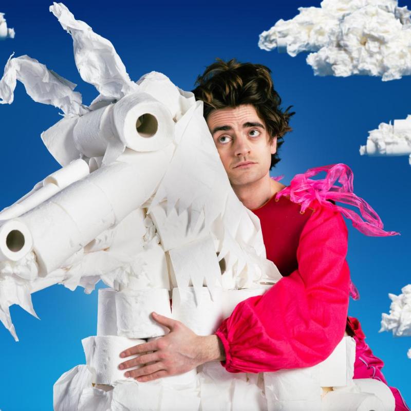 The performer wistfully clutches a horse made out of toilet roll.  