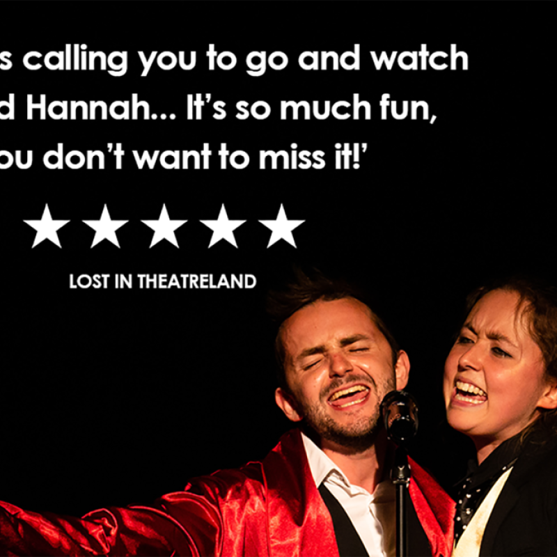 Tim and Hannah sing passionately into a microphone. Tim's hand is extended towards the camera. A review for the show is overlaid on the image and says "Destiny is calling you to go and watch Tim and Hannah... it's so much fun, you don't want to miss it!" 5 stars. Lost in Theatreland