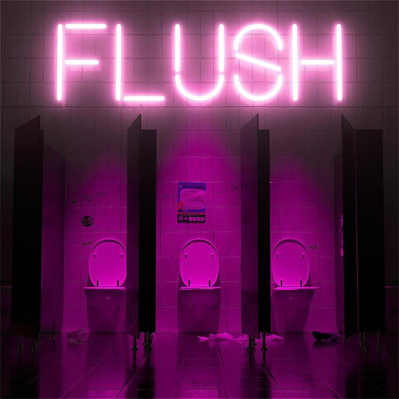 A dimly lit restroom with three stalls, featuring bright pink neon lights spelling "FLUSH" and glowing toilets against a tiled wall.