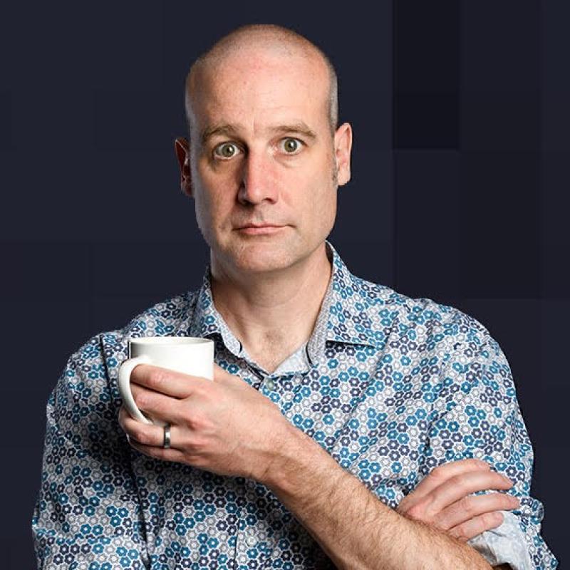 Matt looks into the camera perplexed while holding a white mug