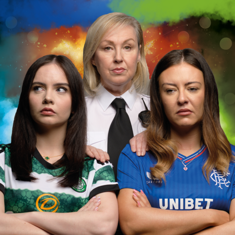 An image of three women. Two women are wearing sports kits in green and blue. The other is wearing a white shirt with black tie.