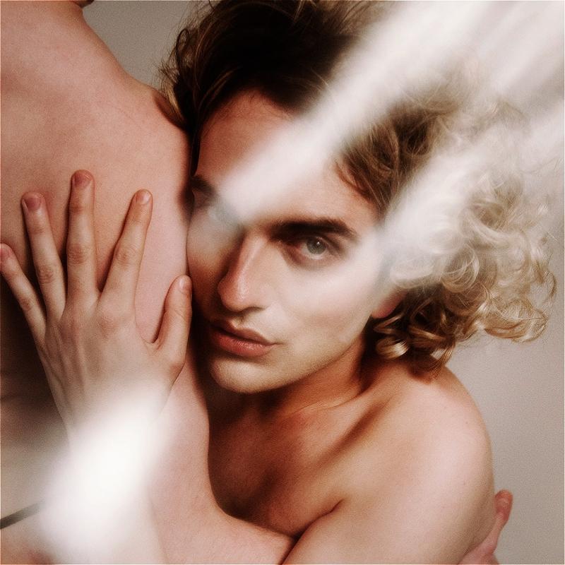 The performer, Jack Sears, looking angelic with wispy blonde hair with a light leak effect