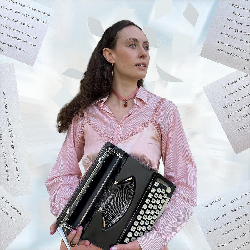 Woman wearing a pink holds a typewriter and is surrounded by falling pieces of paper and writing fragments.