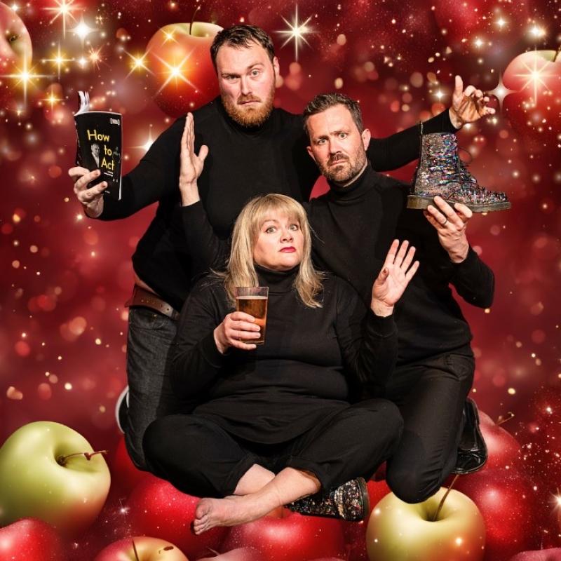 Three actors wearing black surrounded by a glittery apple background.