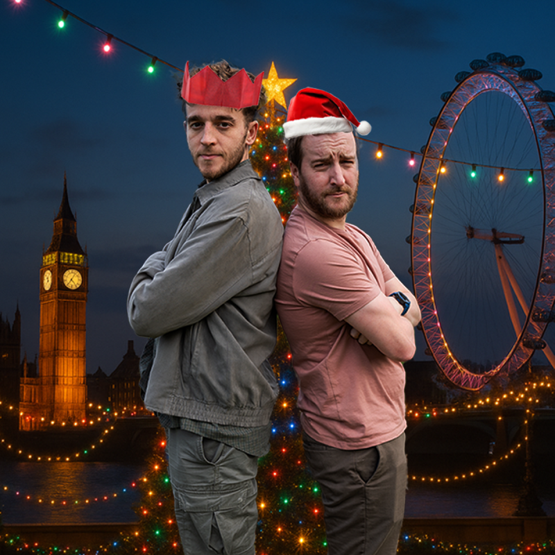 Two performers back to back with a Christmassy London backdrop.
