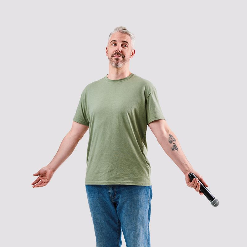 Picture of performer standing with open arms.