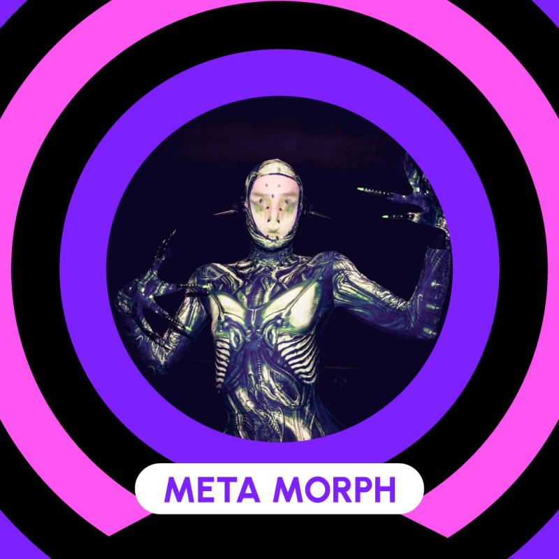 Poster showcasing Meta Morph. Wearing an alien-like costume, with long fingers, a mask and long pointy ears