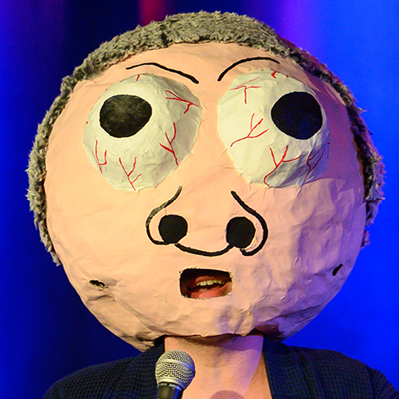 A papier mache head of Basil Crumbwick with bulging eyes and red veins.