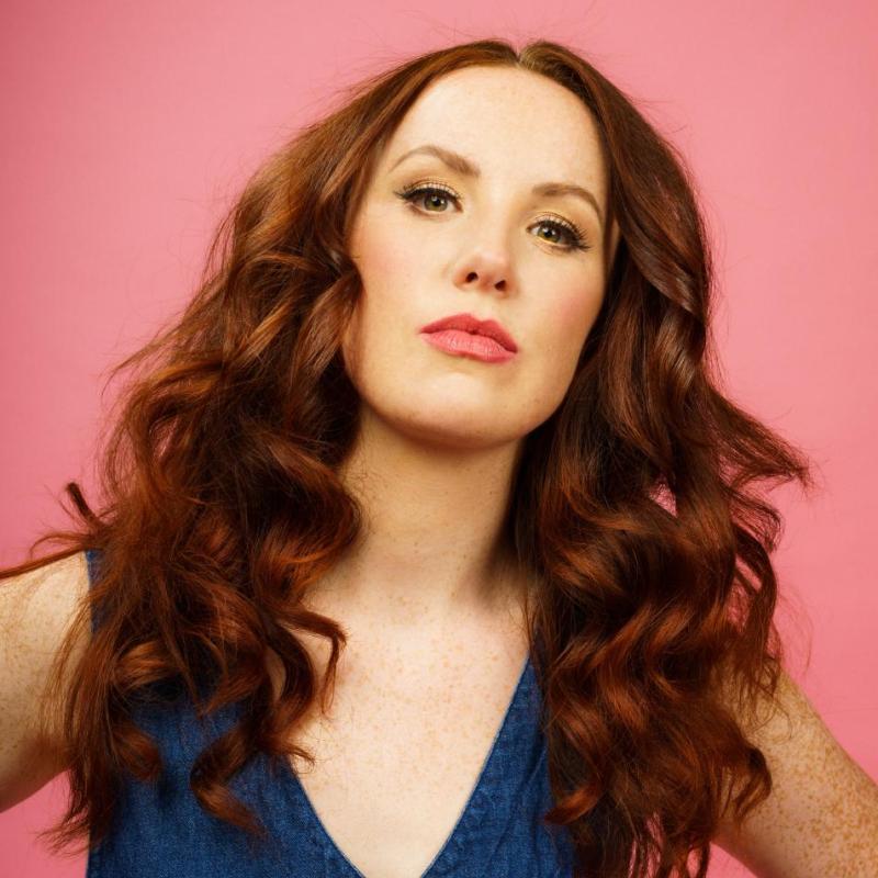 Headshot of Catherine Bohart wearing denim. 