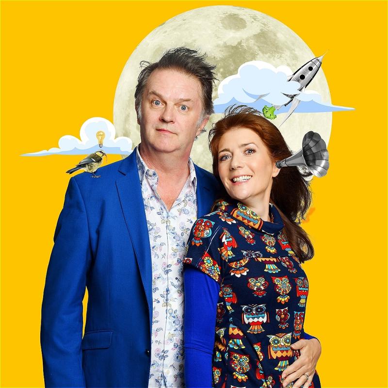 Paul and Suki stand looking at the camera in front of a tangerine backdrop and some clip art style photos of a big moon, rocket ship, cloud, small bird, etc