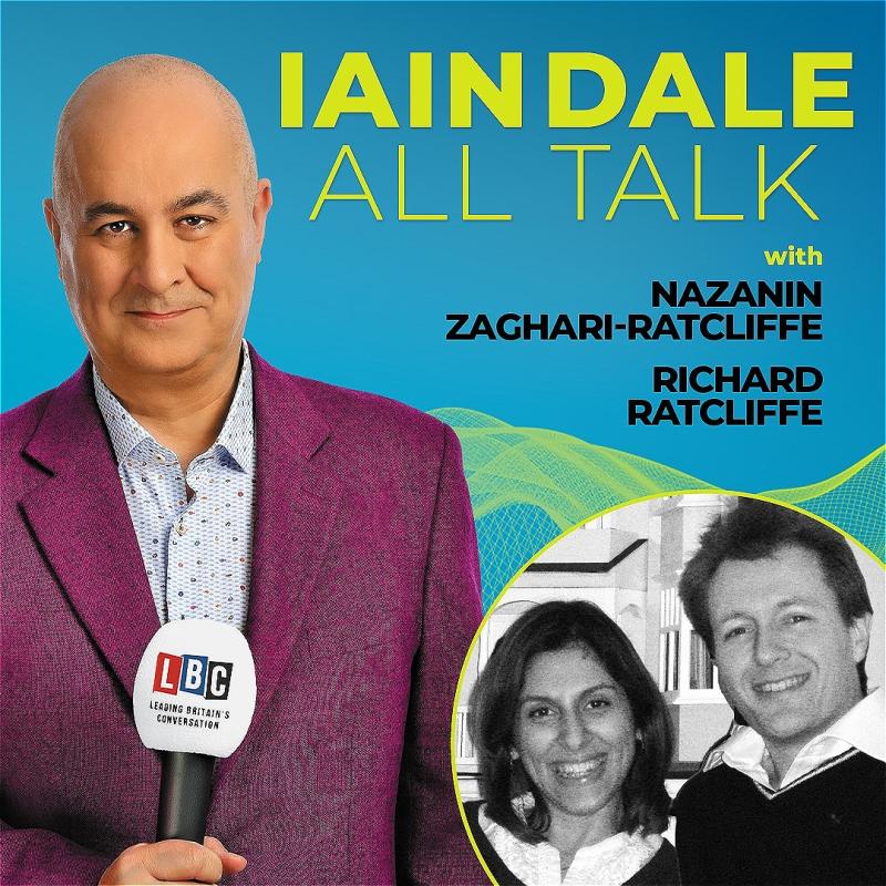 Host Iain Dale stares straight ahead with an LBC microphone wearing a purple blazer before a blue background. A black and white photo of the guests in the bottom right corner.