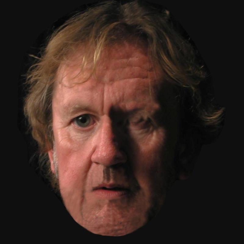 Pip Utton's face against a black background. Looking concerned. 